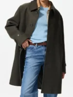 Relaxed fit olive Balmacaan coat styled with an open-button closure.