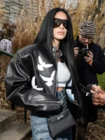 Front view of Camilla Araujo wearing a black leather jacket at PFW 2026, styled by TV Jackets.