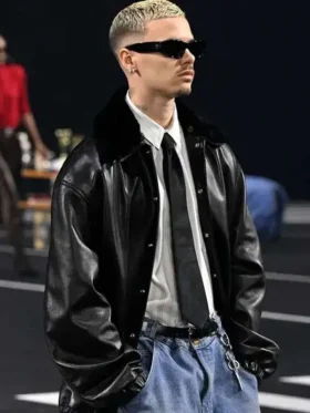 A trendy styling shot of the PFW 2026 Romeo Beckham black leather jacket from TV Jackets.