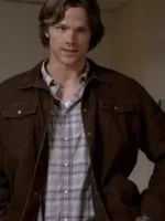 Brown Trucker Jacket front view showcasing the iconic button-down closure and symmetrical pockets.