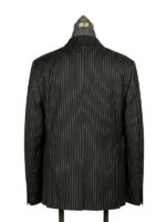 Close-up of a tailored blazer with a classic lapel style collar and open hem cuffs.