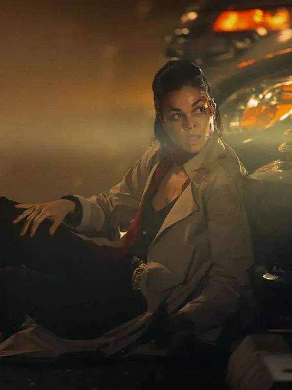 The-Rip-Lina-Esco-2026-Trench-Coat Lina Esco wearing a classic long trench coat in The Rip 2026, styled by TV Jackets.