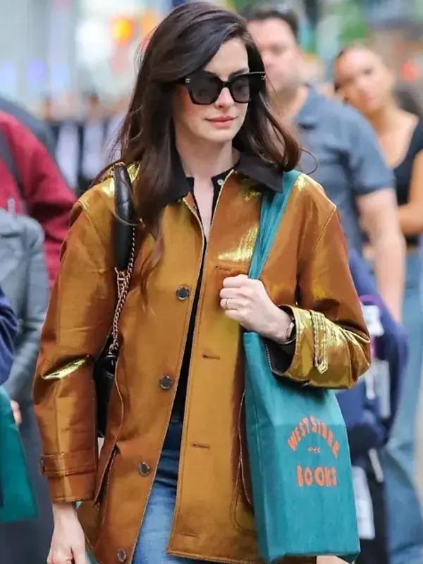 The Viral NYC Street Style Anne Hathaway Gold Metallic Barn Jacket Seen on Anne Hathaway Full view of the viral Anne Hathaway gold metallic barn jacket from her NYC street style look.