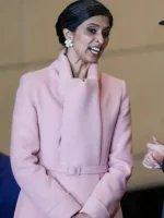 Front close-up of Usha Vance pink coat showing high shawl collar and wrap belt detailing.