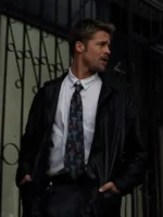 American actor Brad Pitt in his famous black leather detective coat from the movie Se7en.