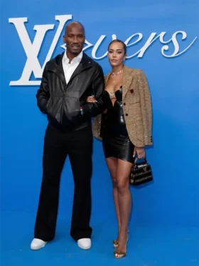 Didier Drogba in a black hooded leather jacket alongside Gabrielle Lemaire in Paris.