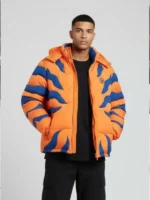 A stylish view of the orange Hypland x Digimon Greymon puffer jacket from TV Jackets.