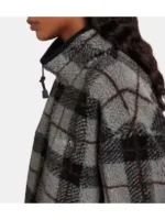 Close-up collar view of grey plaid teddy fleece jacket showing soft texture, neat stitching, and clean neckline finish.
