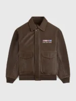 Front view of the brown flight leather jacket with buttoned over zipper closure and flapped pockets.
