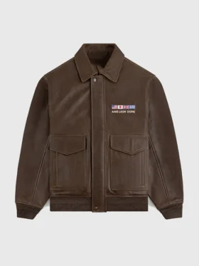 Front view of the brown flight leather jacket with buttoned over zipper closure and flapped pockets.