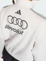Profile view of the Audi Revolut F1 track jacket highlighting the elasticated cuffs and sleeves.