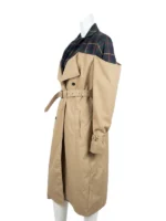 Close-up of a double-breasted cotton trench coat with a structured lapel collar and soft interior lining.