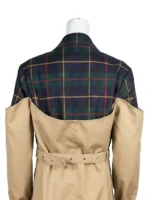 A sophisticated long trench coat featuring a unique plaid shoulder and collar design, inspired by Carrie Milgram in Power Book II: Ghost.