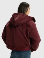 A person wearing the hooded brown Adidas corduroy jacket for a casual 2026 look.