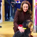 Kate Middleton wearing a burgundy plaid double-breasted coat at Royal Marsden Hospital visit