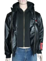 Close-up of the embroidered logos and patches on a black and red Loiter X WWE varsity jacket.