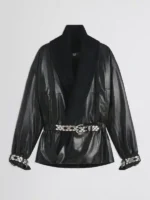 Front view of Mariah Carey black leather jacket featuring a dramatic shawl collar and adjustable belted waist.