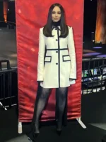 Sofia Carson wearing a Nina Ricci white wool coat dress with black trims at the 31st Annual SAG Awards media event.