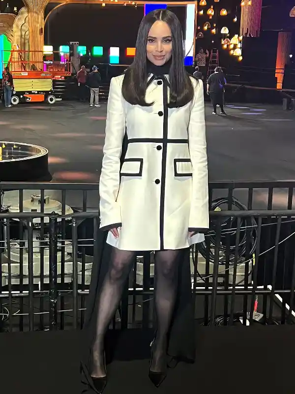 Sofia Carson White Wool Dress Black Trims Close-up of the Sofia Carson inspired white wool dress featuring black velvet trims and round neckline.