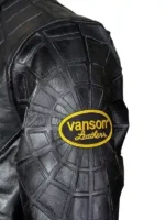 a high-performance red and blue cowhide leather racing jacket with intricate spider web stitching and collaborative patches.