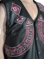 A sleeveless leather vest showing two waist pockets and a clean, sleeveless design for layering.