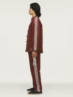 Side view of the Adidas track jacket showing the white rope 3-stripes on the arm.