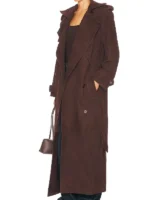 Close-up of the waist belt and shoulder epaulettes on the brown suede trench coat.