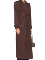 Macro shot showing the soft and velvety texture of the brown suede leather material.