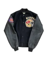 A sleek black version of the 49ers vintage letterman jacket with black leather sleeves and golden helmet logo.