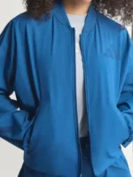 Close-up of the front closure on the Adidas Babymonster Jacket.