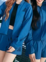 Side profile of the stylish Adidas Babymonster Jacket.