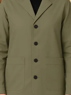 Close-up of the front closure on the Drama Zendaya Green Cotton Jacket.