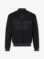 Back view of the black England Rugby x Undefeated x Castore bomber jacket with bold tonal branding.