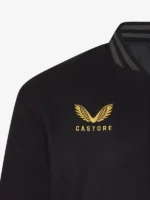 A premium black satin bomber jacket from the England Rugby x Undefeated x Castore collaboration.