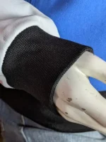 Athletic blue varsity jacket with white leather sleeves detail.