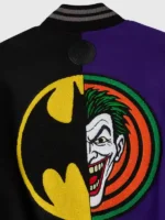 Close-up of the back graphics on the OVO Batman Joker Split Varsity Jacket.