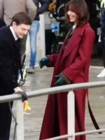 Side profile view of the Rebecca Hall The Beauty Maroon Coat.