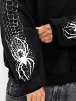 Close-up of the hardware clips on the Spider Crest Black Hoodie.