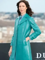 Side profile view of The Beauty Photocall Blue Coat.