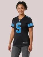 Close-up of the V-neck collar and Nike branding on the black David Montgomery game jersey.