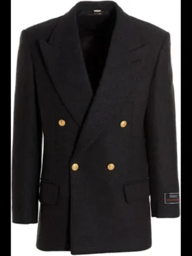 Close-up of the grey Gucci double breasted wool jacket with peak lapels and signature gold buttons as seen on Ryan Gosling.