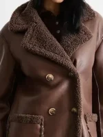 Close-up of the fabric on the whipstitch shearling leather coat.