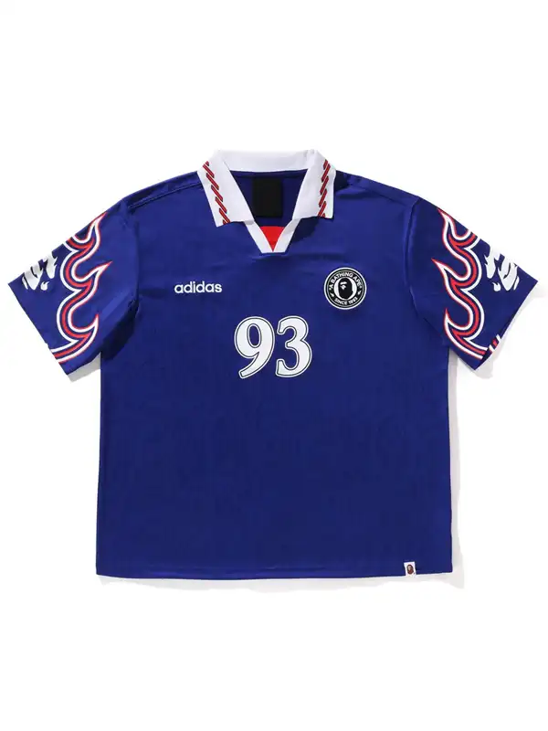 The front profile of the Adidas Bape 93 Flame Jersey showcasing the clean V-neck collar and central branding.