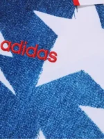 A professional display of the Adidas X Bape LS Star Jersey featuring its signature long sleeves and cosmic star graphics.