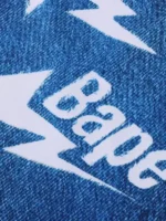 A stylish lifestyle profile of the Adidas X Bape LS Star Jersey showcasing its modern drape and vibrant blue tones.