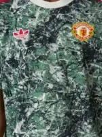 Macro detail shot of the Adidas x Stone Roses OG Icon T-Shirt texture.