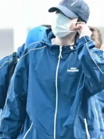 A macro shot of the breathable fabric texture and fine stitching on the BTS Keep Swimming Blue Jacket.