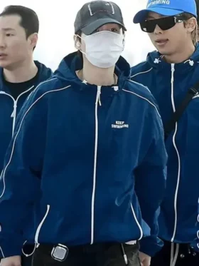 The front profile of the BTS Keep Swimming Blue Jacket featuring a tidy collar and balanced blue tones.