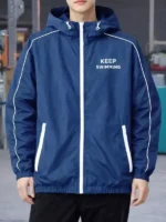 The front profile of the BTS Keep Swimming Blue Jacket featuring a tidy collar and smooth fabric finish.