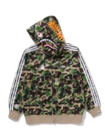 A full lifestyle profile of the Bape x Adidas Camo Shark Full Zip Hoodie showing its bold camouflage pattern and signature hood design.